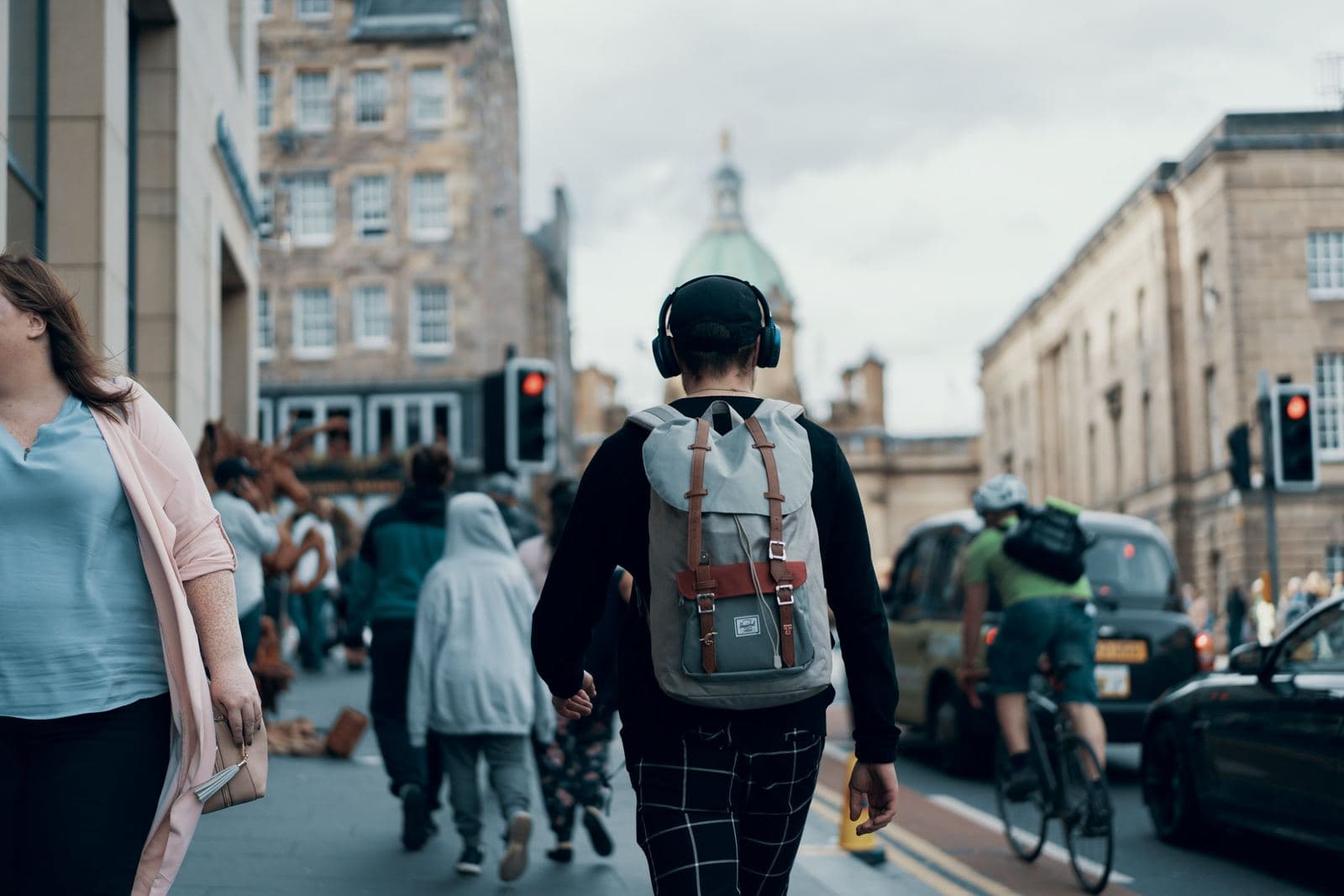 Crowds walking along the Royal Mile in Edinburgh during festival season. Photo by Ross Sneddon on Unsplash.