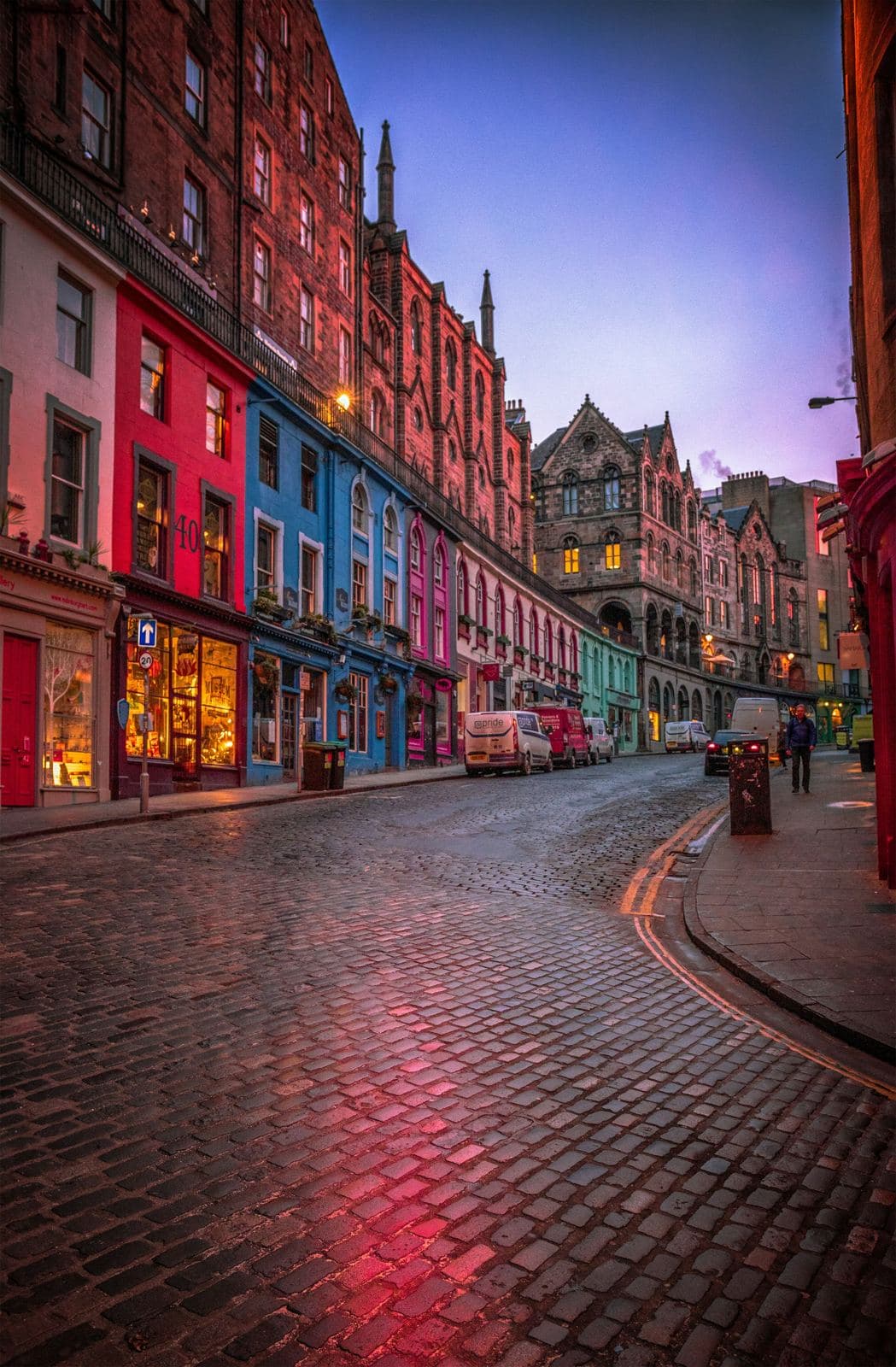 Families and visitors walking along an Edinburgh Old Town street near the Royal Mile during festival season. Photo by jim Divine on Unsplash.